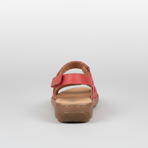 Red sandal with a brown sole on a white background