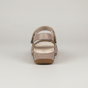 Beige sandal on a light gray background