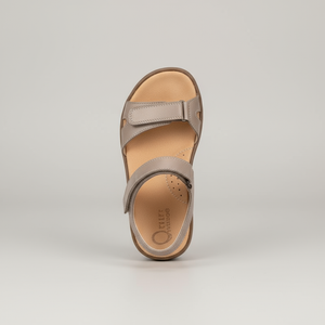 Taupe sandal on a light gray background