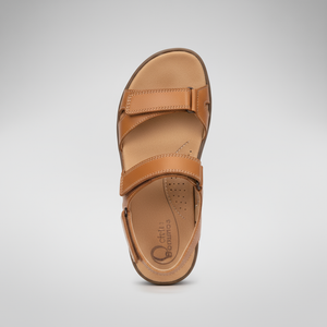 Tan sandal on a light gray background