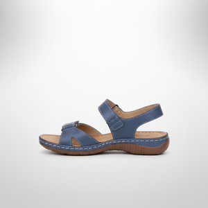 Blue sandal with brown sole on a white background