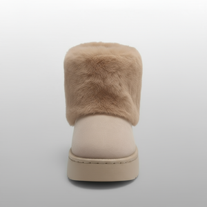 Beige slip-on shoe with fur trim on a light gray background