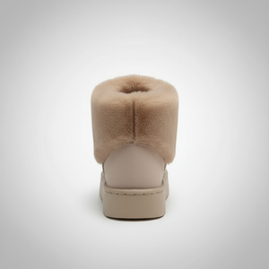 Beige slip-on shoe with fluffy top on a white background