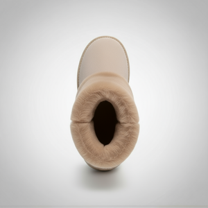 Beige winter boot with fur lining on a light gray background