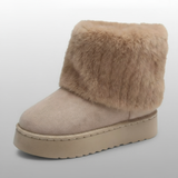 Beige winter boot with fur cuff on a light gray background