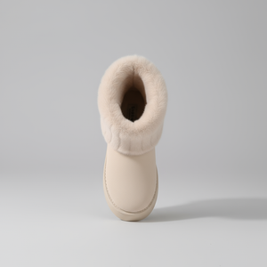 Beige slipper boot with fluffy interior on a light gray background