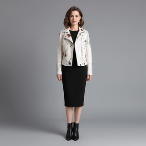 Woman wearing a white floral embroidered jacket on a gray background