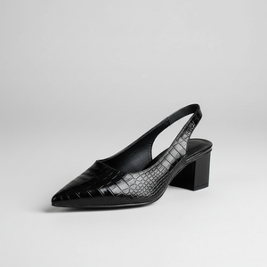 Black slingback shoe with crocodile texture on a light gray background