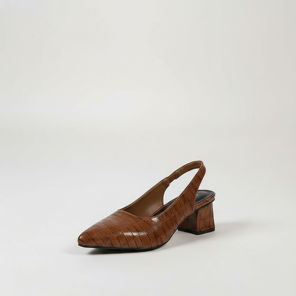 Brown slingback shoe on a light gray background