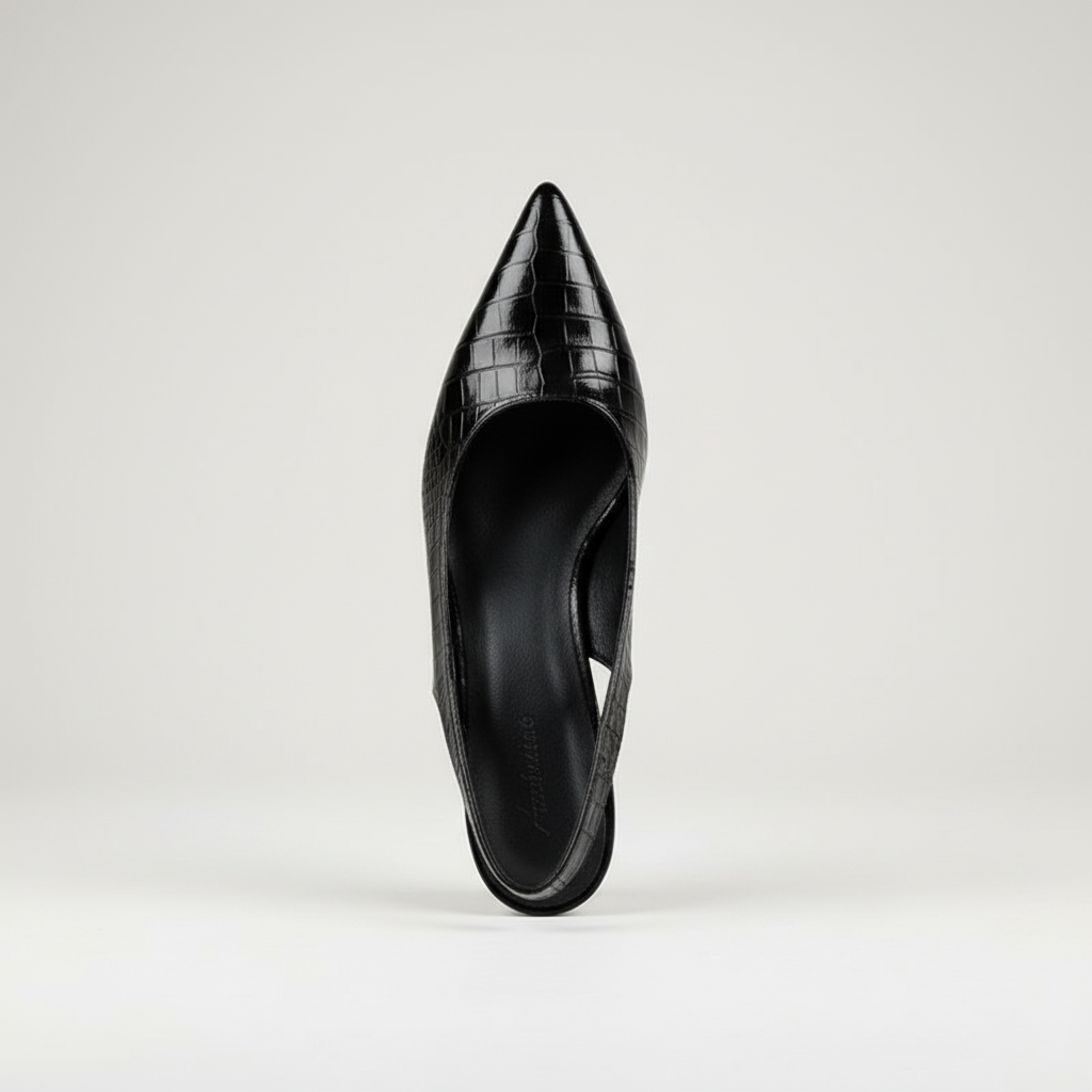Black pointed-toe high-heeled shoe on a light gray background