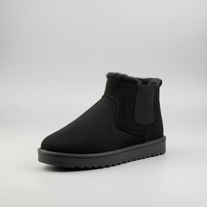 Black ankle boot with a white background