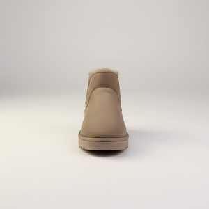 Beige ankle boot with fur lining on a white background