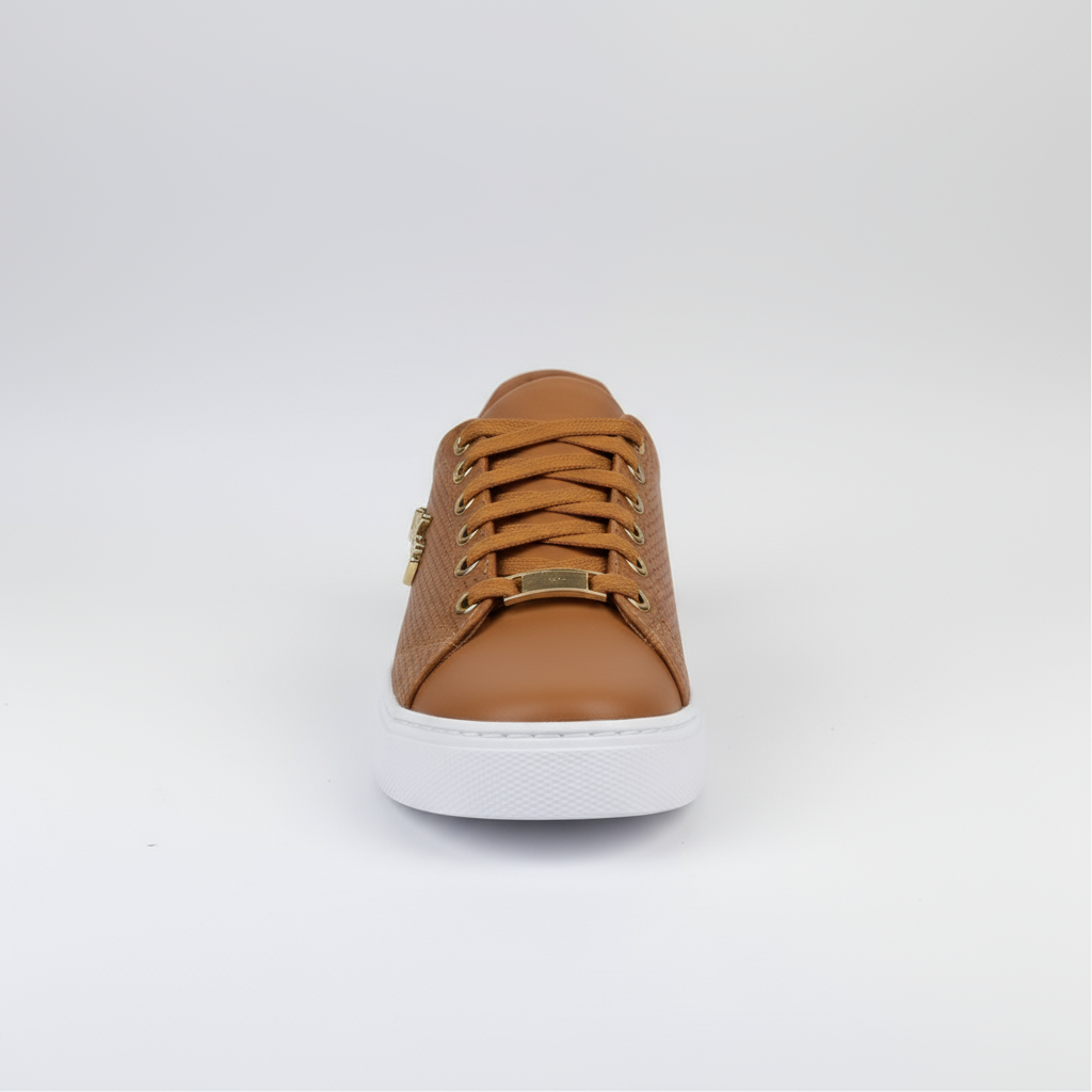 Brown sneaker with white sole on a light gray background