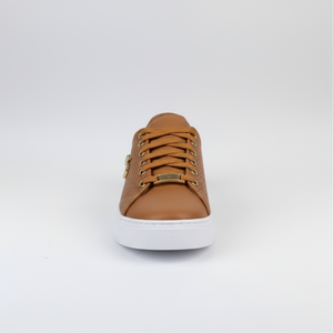 Brown sneaker with white sole on a light gray background