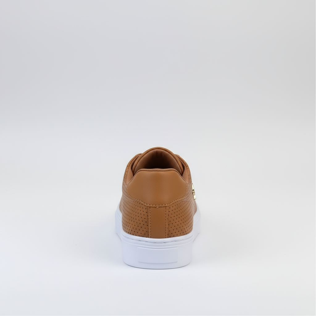 Brown sneaker with white sole on a light gray background