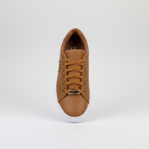 Brown sneaker on a light gray background