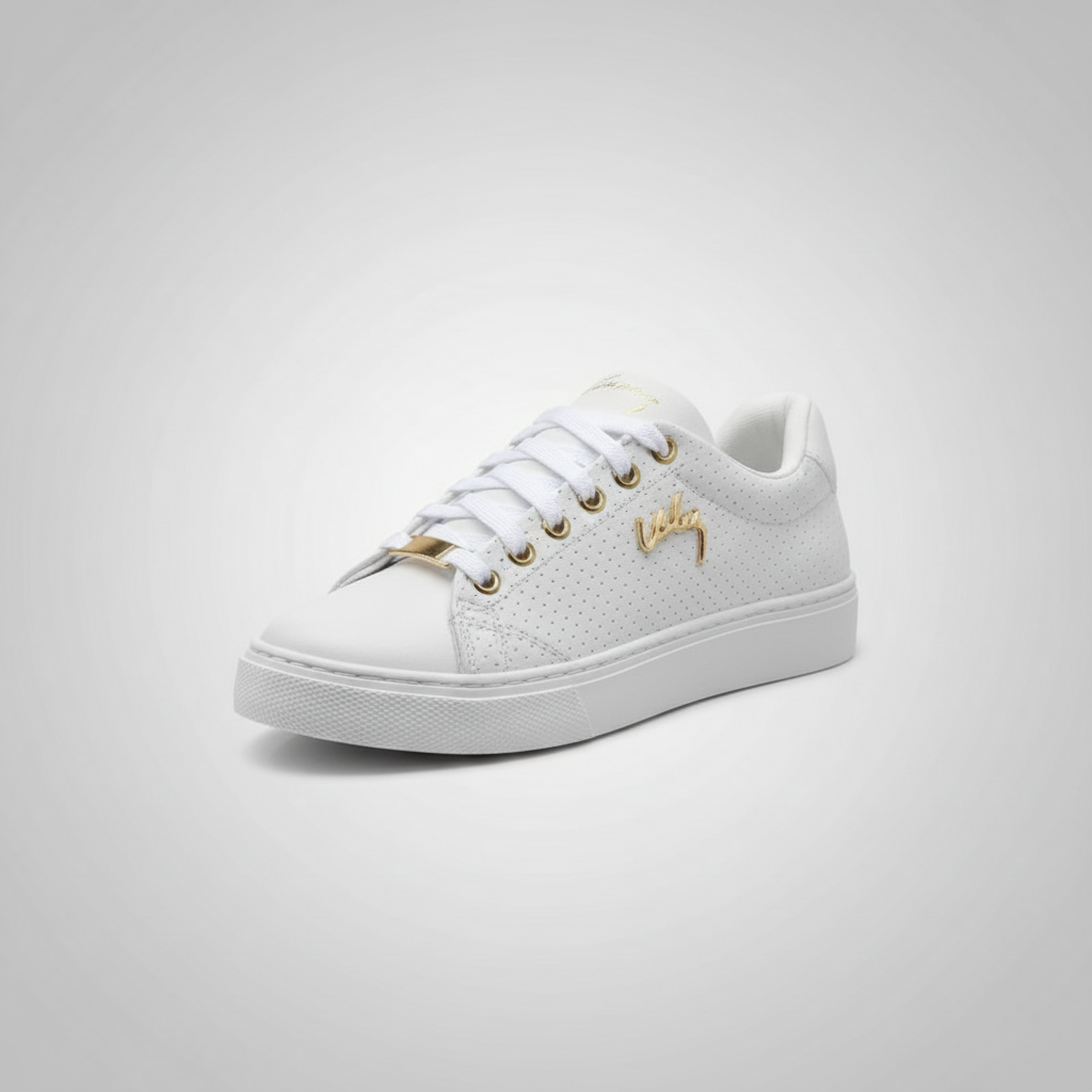White sneaker with gold accents on a light gray background