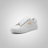 White sneaker with gold accents on a light gray background