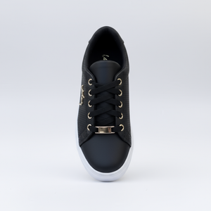Black sneaker with gold accents on a white background