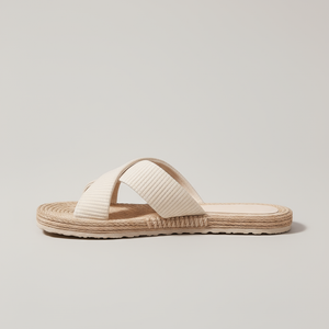 Beige sandal with woven sole on a light gray background