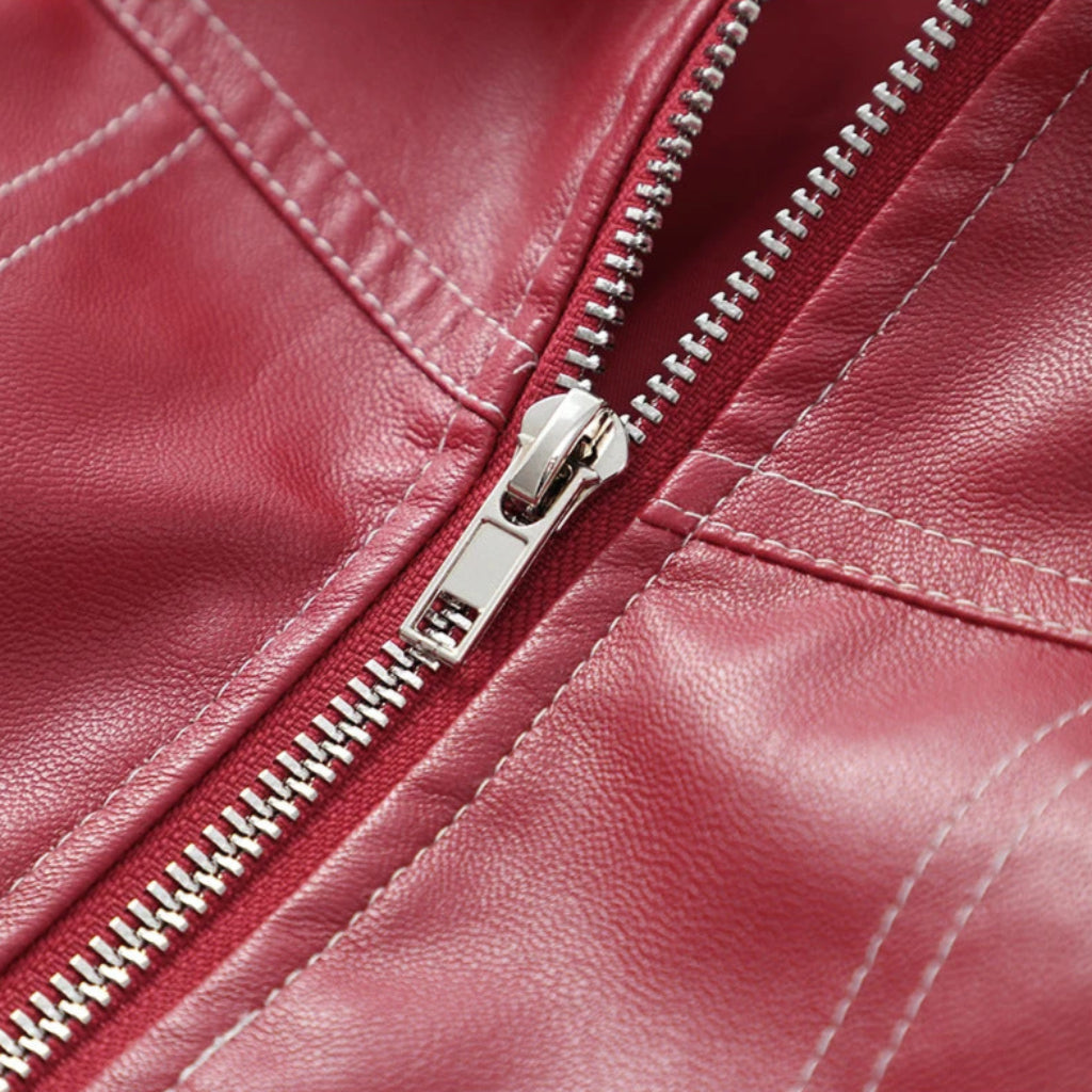 Close-up of a red leather jacket with a zipper