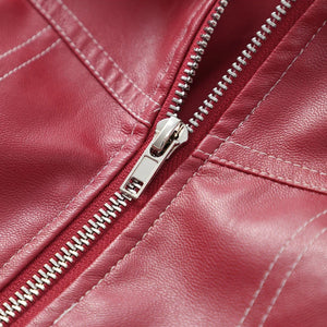 Close-up of a red leather jacket with a zipper
