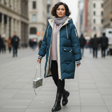 Woman wearing a blue puffer coat on a city street
