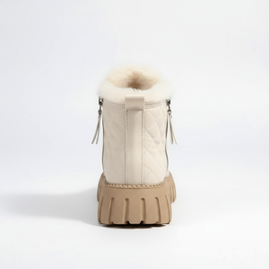 Beige winter boot with fur lining on a white background