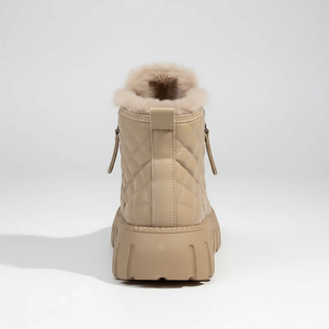 Beige winter boot with fur lining on a white background
