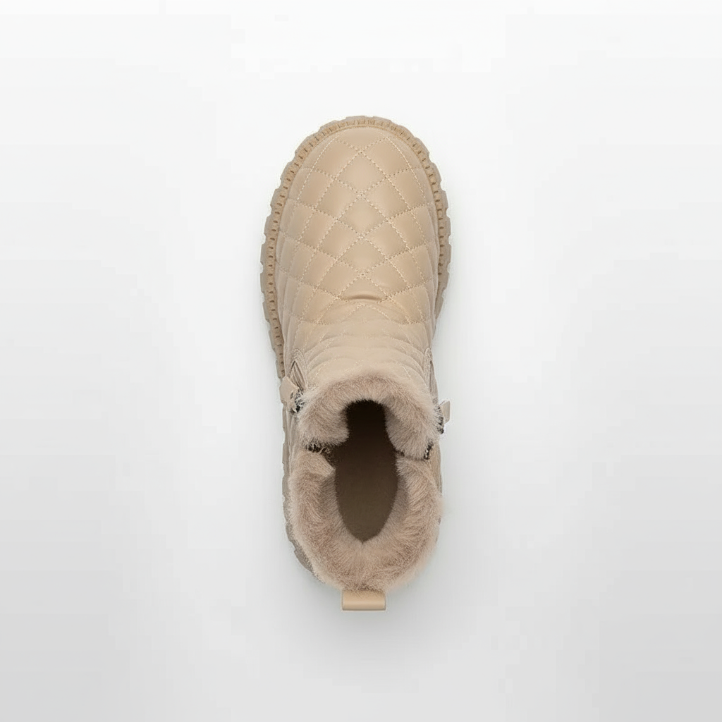 Beige quilted boot on a white background