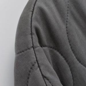 Close-up of a gray fabric texture on a white background