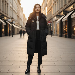 Woman wearing a black coat on a city street