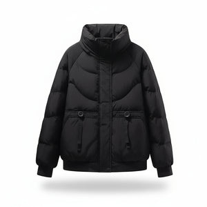 Black puffer jacket on a mannequin with a beige sweater underneath against a beige background