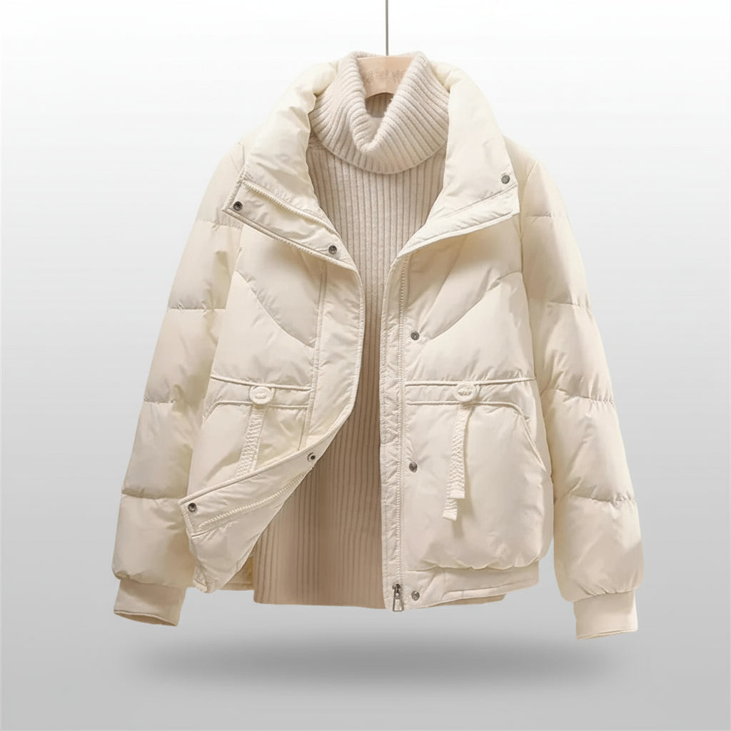 White puffer jacket on a mannequin against a beige background