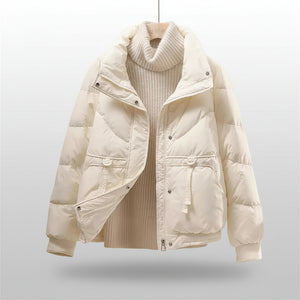 White puffer jacket on a mannequin against a beige background