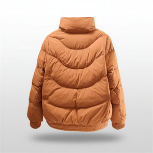 Brown puffer jacket on a light beige background