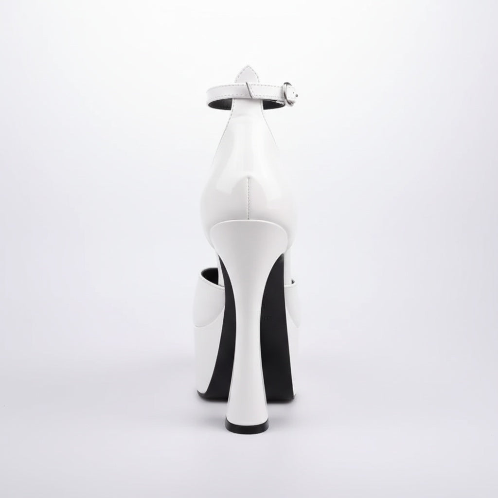 White high-heeled shoes with a black sole on a white background