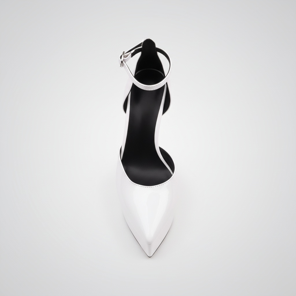 Black high-heeled shoe with a white sole on a light gray background