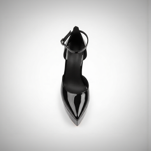 Black high-heeled shoe on a light gray background