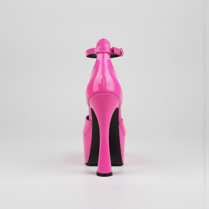 Pink high-heeled shoe with a black sole on a light gray background