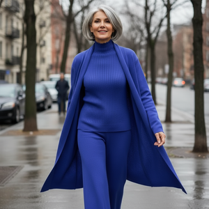 Woman in a blue outfit walking on a city street