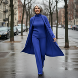 Woman in a blue outfit walking on a city street