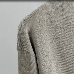 Close-up of a textured gray fabric on a plain background