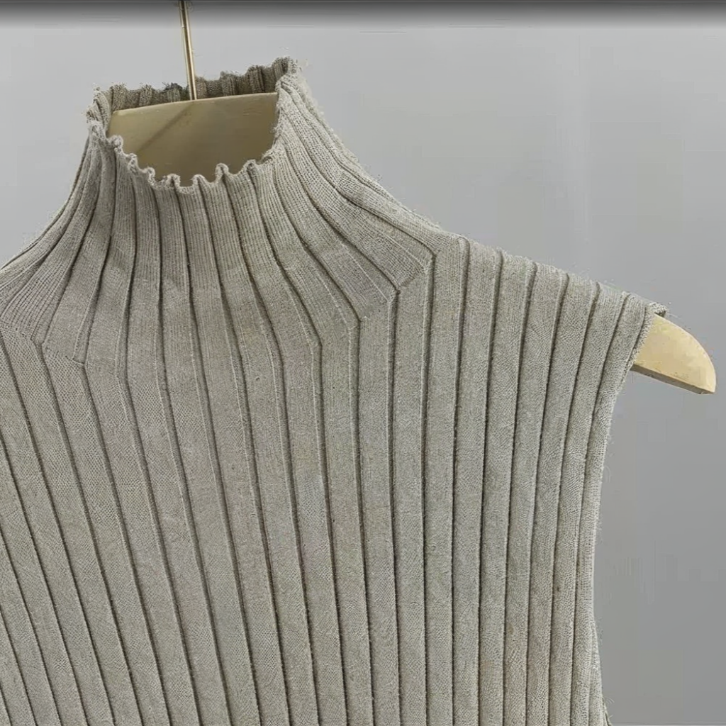 Light gray ribbed knit sleeveless top on a hanger against a light gray background