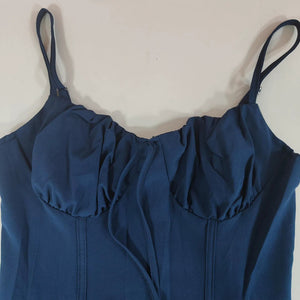 Blue dress with ruched neckline on a white background