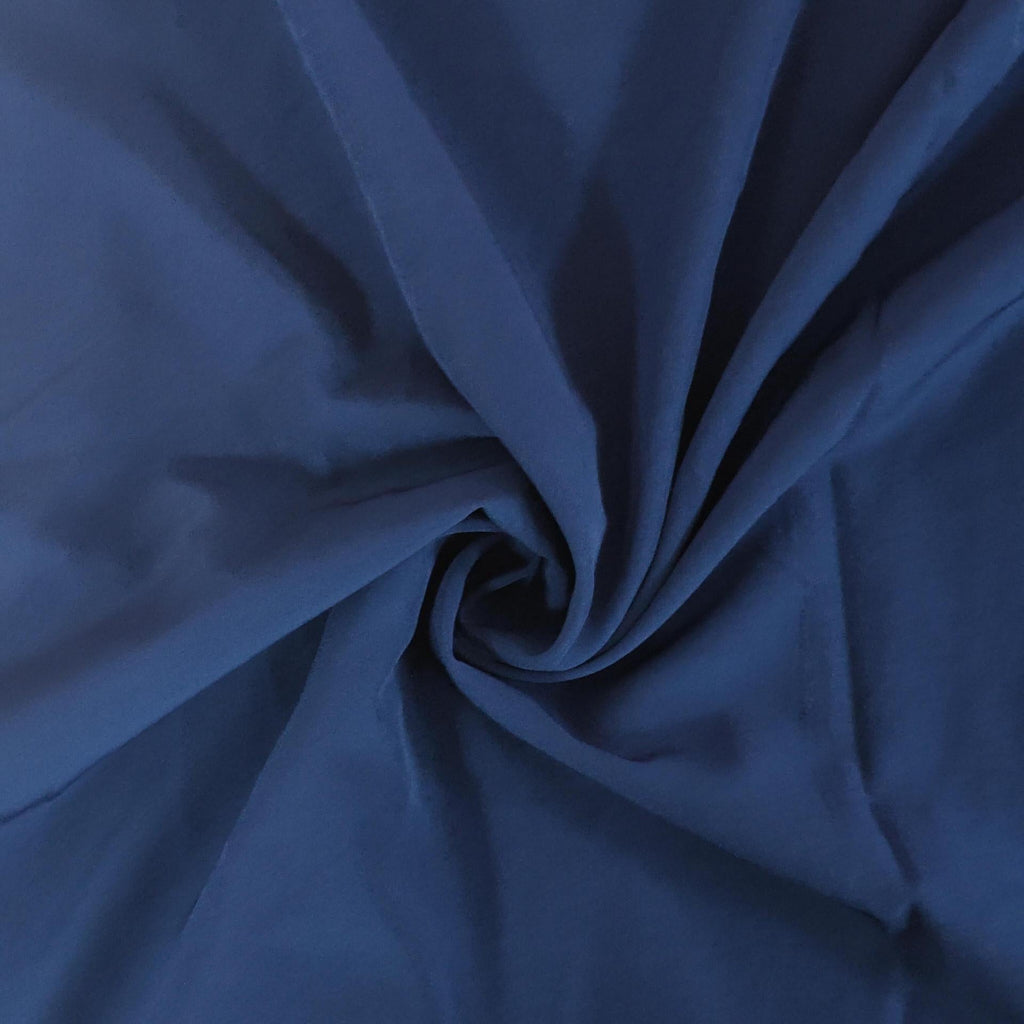 Close-up of blue fabric with a swirl pattern