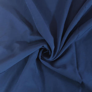Close-up of blue fabric with a swirl pattern
