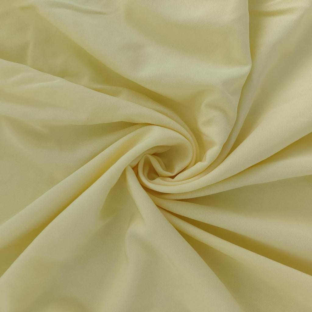 Close-up of light yellow fabric with folds