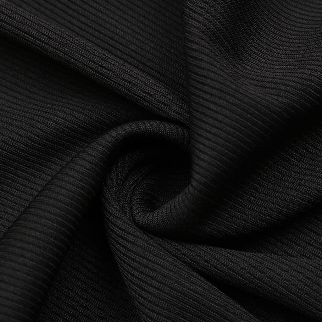 Close-up of black ribbed fabric with a focus on texture and pattern.