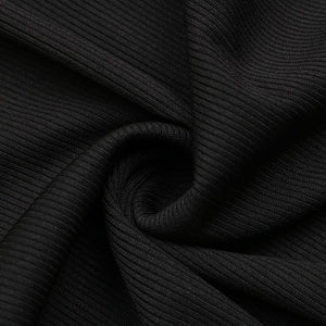 Close-up of black ribbed fabric with a focus on texture and pattern.